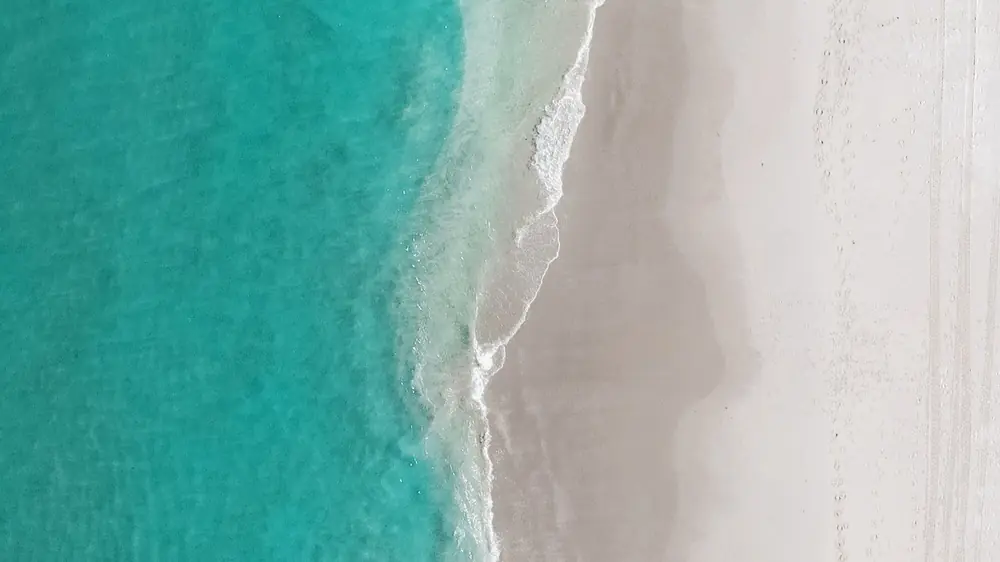 Turquoise water meeting a South Florida beach